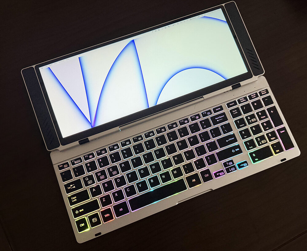 main view of VitaLink ultra-thin (20mm) foldable workspace device, showing the 13" 4K touchscreen, metal RGB keyboard, and 180° hinge design. Icons below illustrate features like 4K display, 10-finger touch, and multi-OS compatibility.